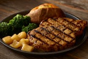 Order Mesquite-Grilled Pork Chops food online from Logan's Roadhouse store, Wichita on bringmethat.com