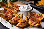 Order Made-From-Scratch Loaded Potato Skins food online from Logan's Roadhouse store, Wichita on bringmethat.com
